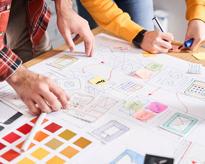 UX designers drawing the application